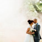 West Mill Derby wedding bride and groom in sunlight with background of smoke